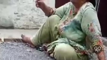Desi Pakistani Aunty Puffing Smoke With Sultry Seduction